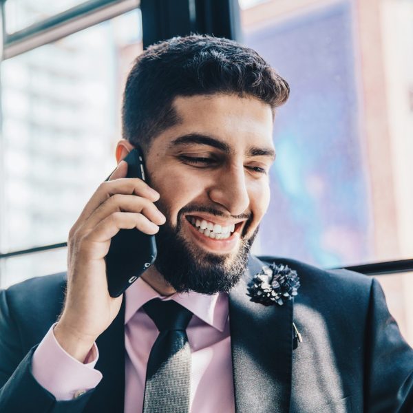Man-Smiling-Holding Phone-Private-Coaching